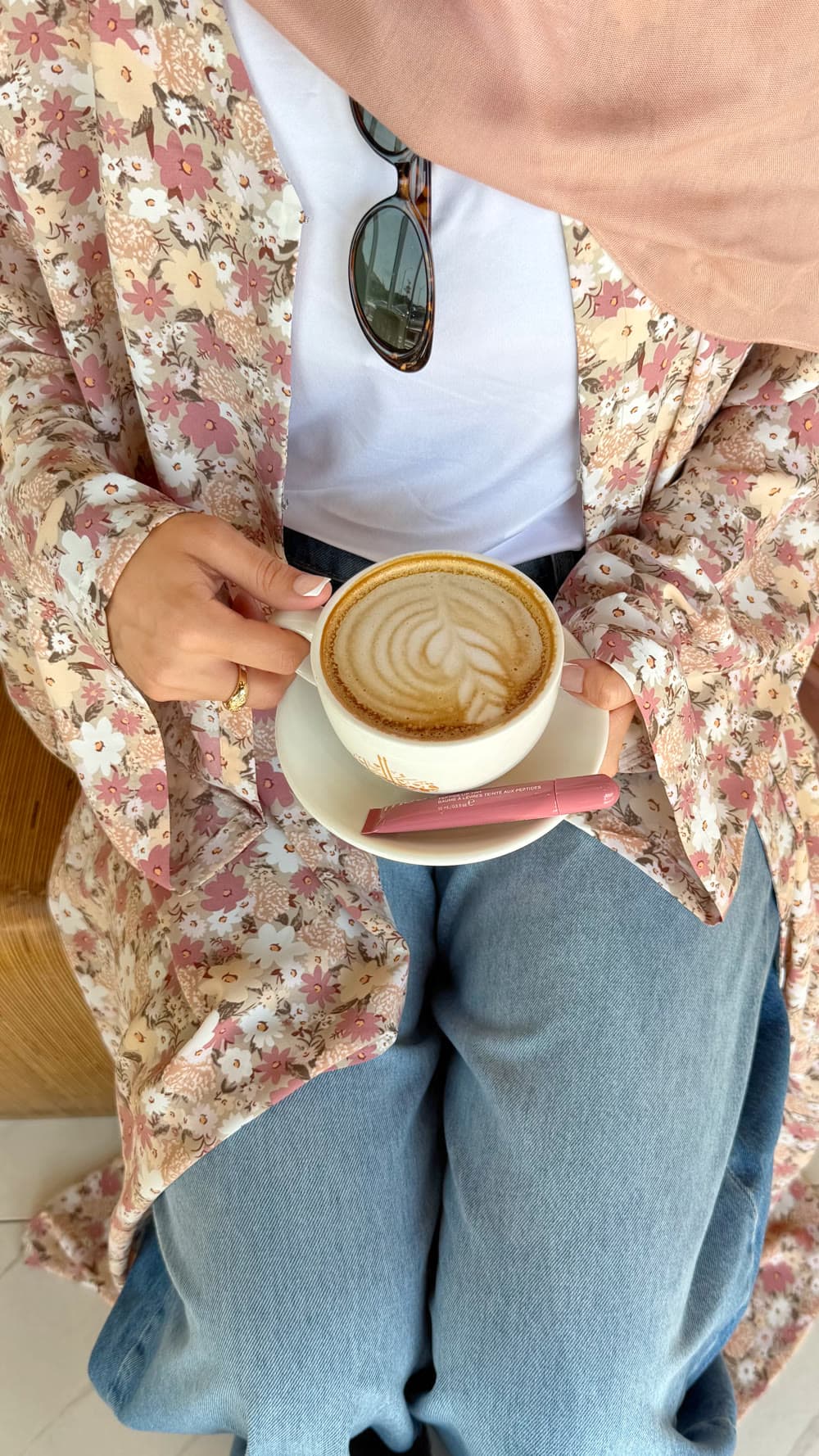 A latte, held close